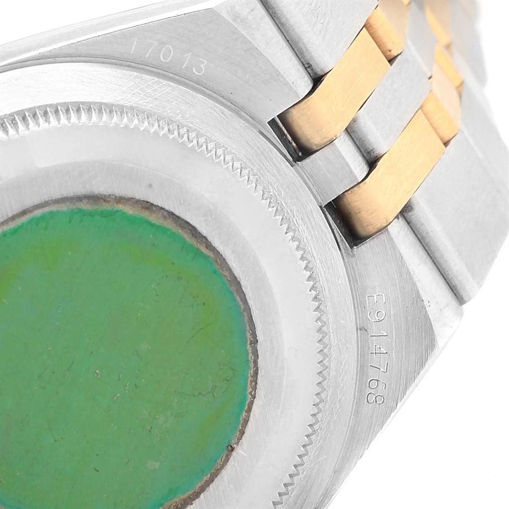 This image shows the back case and part of the metal bracelet of a Rolex Oysterquartz 17013 Men
s Stainless Steel Blue Dial 17013 Men
s Stainless Steel Blue Dial watch.