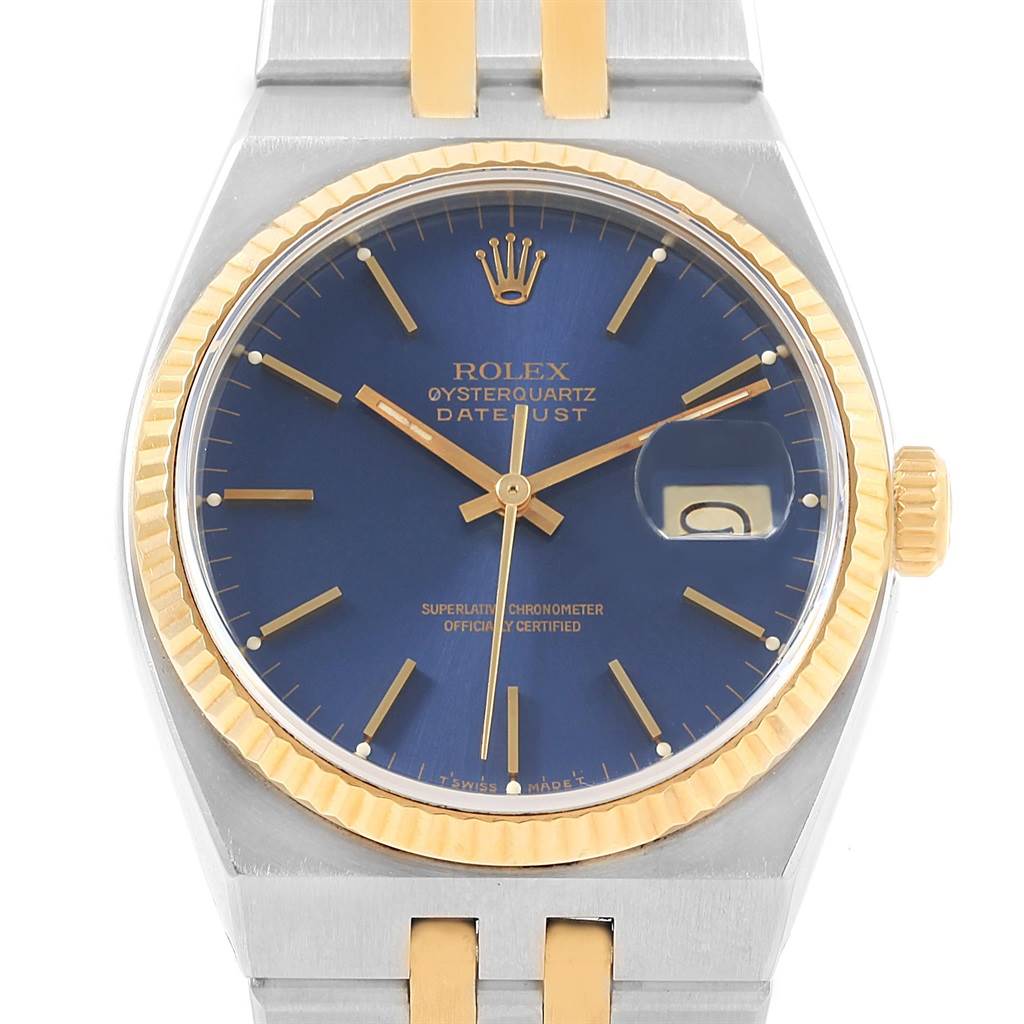 The image shows the face of a Rolex Oysterquartz 17013 Men
s Stainless Steel Blue Dial 17013 Men
s Stainless Steel Blue Dial Datejust watch with a blue dial and two-tone metal bracelet.