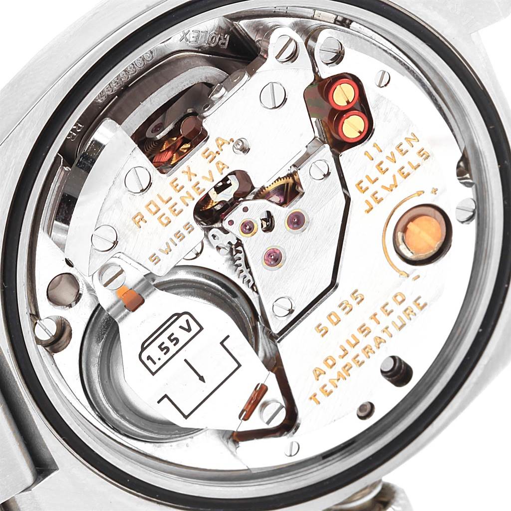 The image shows a close-up view of the movement and inner workings of a Rolex Oysterquartz 17000 Men's Stainless Steel White Dial 17000 Men's Stainless Steel White Dial watch.
