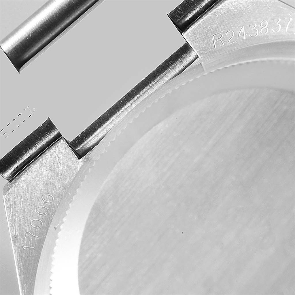 The image shows a close-up of the case and lugs of a Rolex Oysterquartz 17000 Men's Stainless Steel White Dial 17000 Men's Stainless Steel White Dial model, with part of the bracelet and serial number.