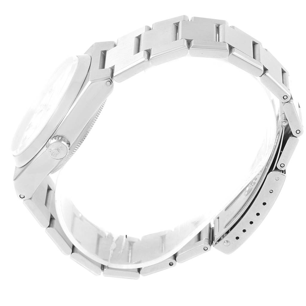 The Rolex Oysterquartz 17000 Men's Stainless Steel White Dial 17000 Men's Stainless Steel White Dial watch is shown from a side angle, highlighting the case, crown, and bracelet links.