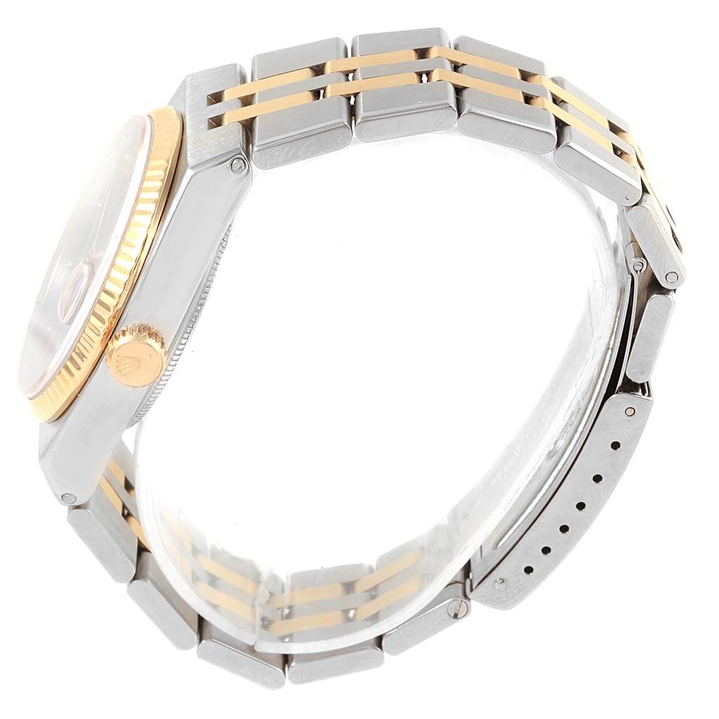 The image shows a side view of the Rolex Oysterquartz 17013 Men
s Steel and Gold (two tone) Blue Dial 17013 Men
s Steel and Gold (two tone) Blue Dial watch, highlighting the bracelet and crown.