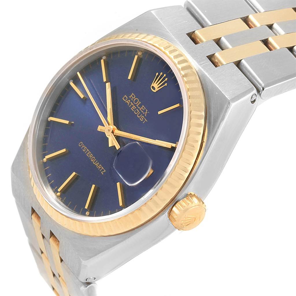 This image shows a close-up angled view of the Rolex Oysterquartz 17013 Men
s Steel and Gold (two tone) Blue Dial 17013 Men
s Steel and Gold (two tone) Blue Dial watch, focusing on its dial, bezel, crown, and part of the bracelet.