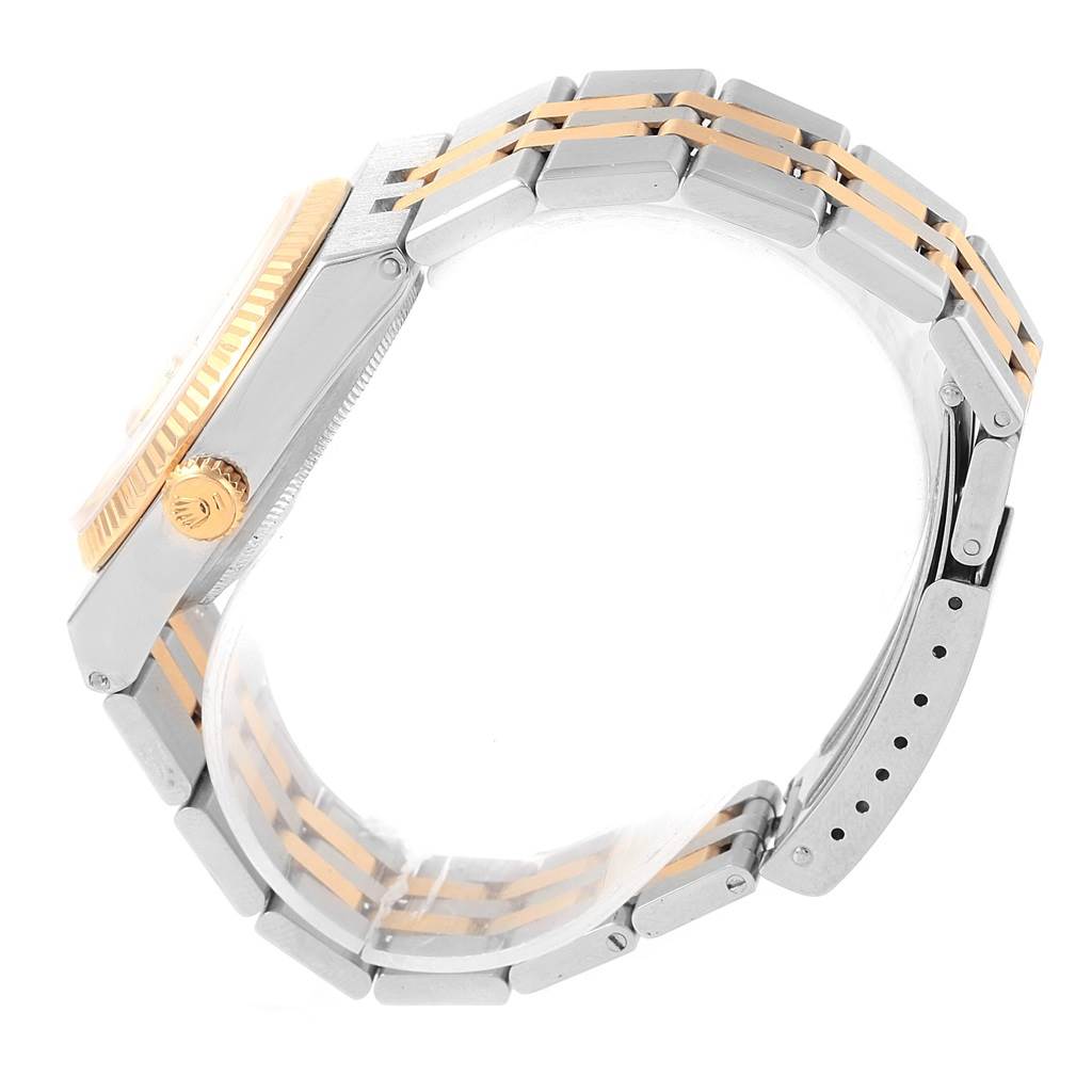 The image shows a side view of a Rolex Oysterquartz 17013 Men's Stainless Steel Champagne Dial 17013 Men's Stainless Steel Champagne Dial watch, highlighting its crown, case, and two-tone bracelet.