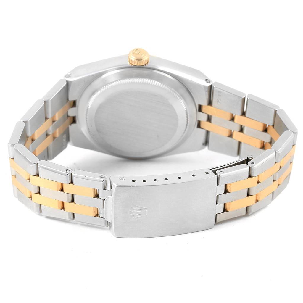 The image shows the back view of a Rolex Oysterquartz 17013 Men's Stainless Steel Champagne Dial 17013 Men's Stainless Steel Champagne Dial watch, displaying the case back, crown, and two-tone bracelet with a clasp.