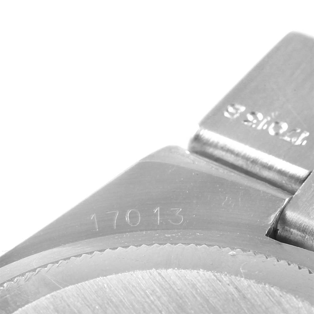 This image shows a close-up view of the Rolex Oysterquartz 17013 Men's Stainless Steel Champagne Dial 17013 Men's Stainless Steel Champagne Dial model, focusing on part of its case and bracelet, with the model number 17013 visible.