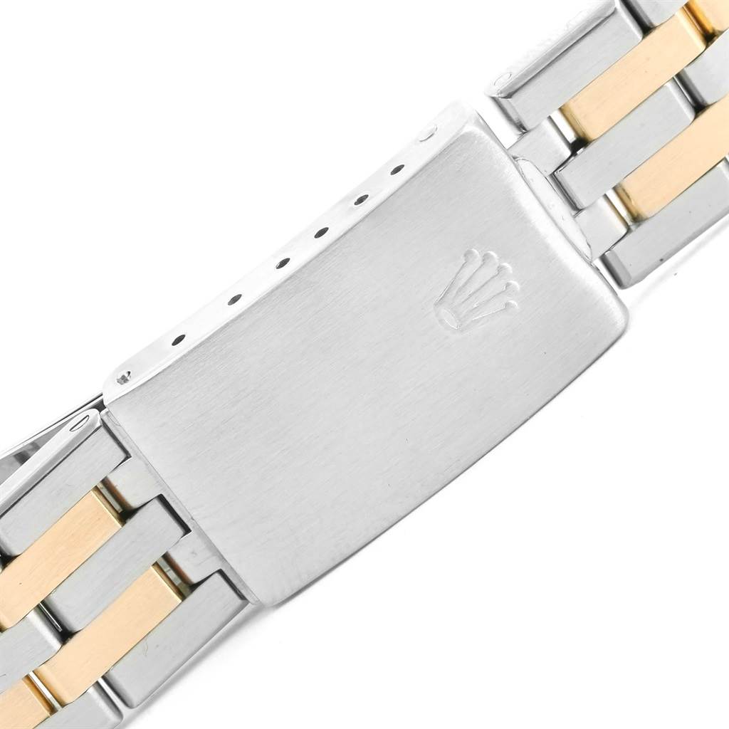 This image shows a close-up of the clasp and part of the two-tone bracelet of a Rolex Oysterquartz 17013 Men's Steel and Gold (two tone) White Dial 17013 Men's Steel and Gold (two tone) White Dial model watch.