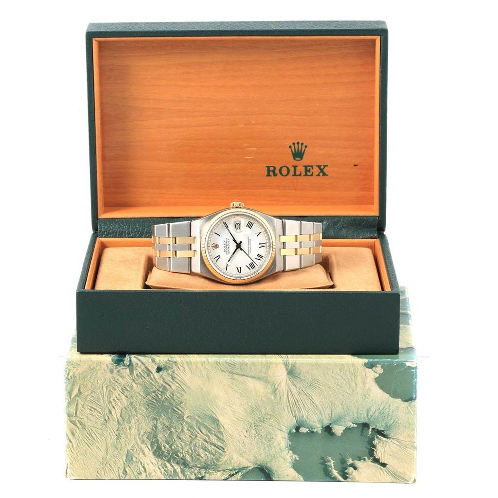 This image shows a front-facing angle of a Rolex Oysterquartz 17013 Men's Steel and Gold (two tone) White Dial 17013 Men's Steel and Gold (two tone) White Dial watch in its open box with the brand logo visible.