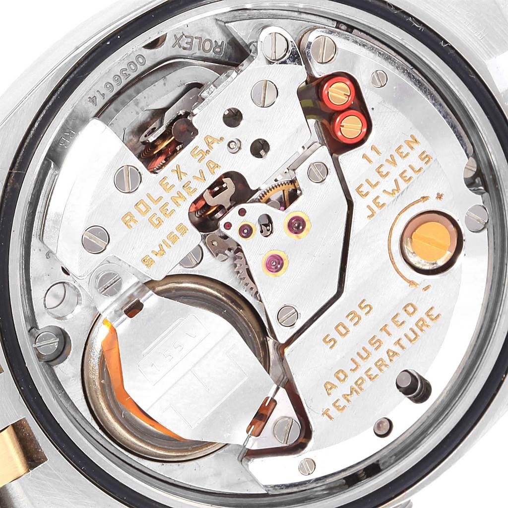 The image shows the interior movement mechanism of a Rolex Oysterquartz 17013 Men's Steel and Gold (two tone) White Dial 17013 Men's Steel and Gold (two tone) White Dial watch at an angled close-up.