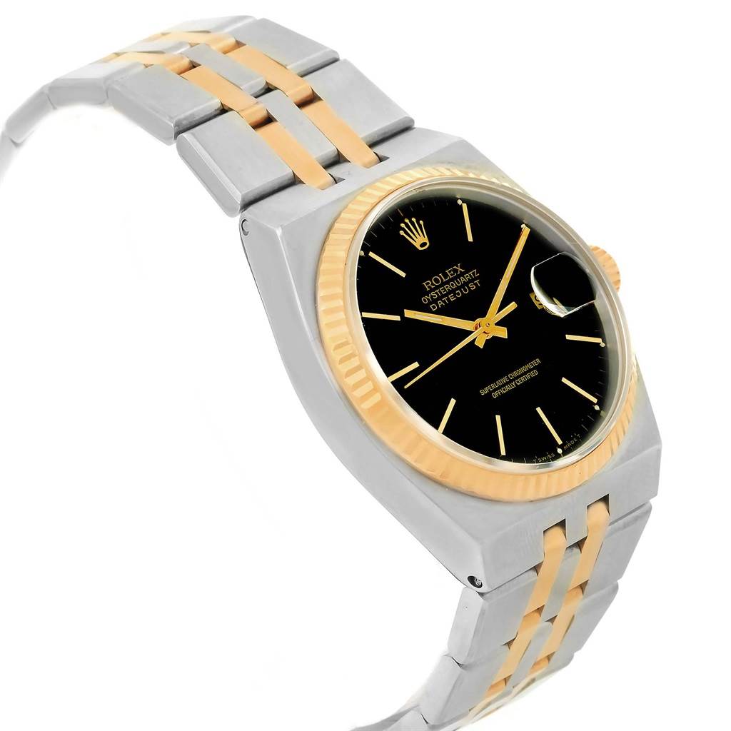 The image shows a side angle of a Rolex Oysterquartz 17013 Men's Stainless Steel Black Dial 17013 Men's Stainless Steel Black Dial watch, highlighting its dial, case, and two-tone bracelet.