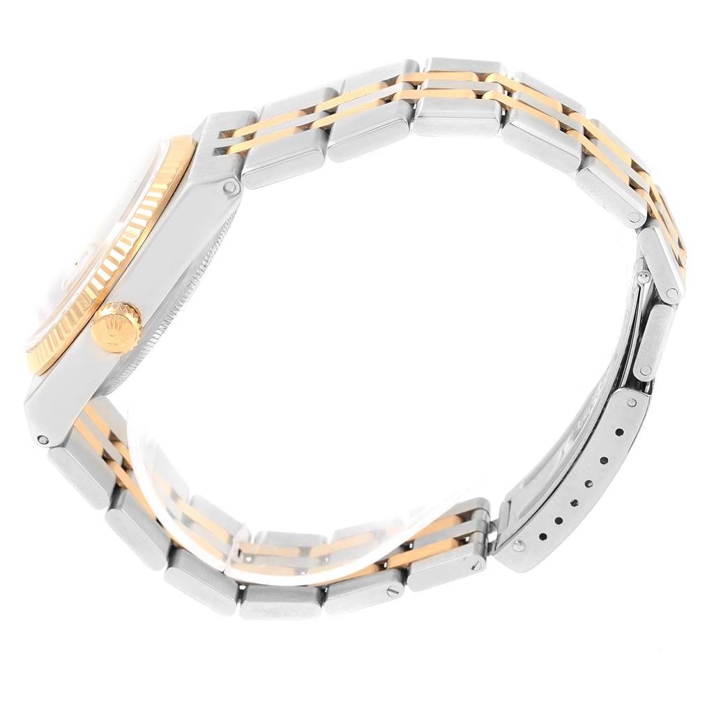 The image shows a side view of the Rolex Oysterquartz 17013 Men's Stainless Steel Black Dial 17013 Men's Stainless Steel Black Dial watch, highlighting its crown, case, and metal bracelet.