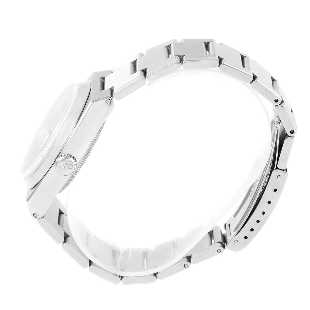 This side view of the Rolex Oysterquartz 17000 Men's Stainless Steel Black Dial 17000 Men's Stainless Steel Black Dial watch displays the case, crown, and bracelet with clasp.