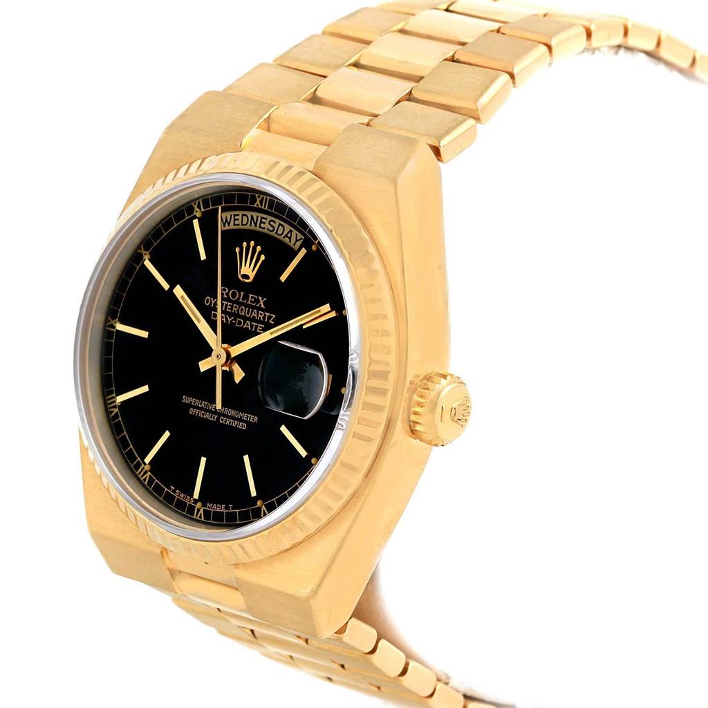 This image shows a Rolex Oysterquartz 19018 Men
s Yellow Gold Black Dial 19018 Men
s Yellow Gold Black Dial watch at a three-quarter angle, highlighting the dial, bezel, crown, and part of the bracelet.