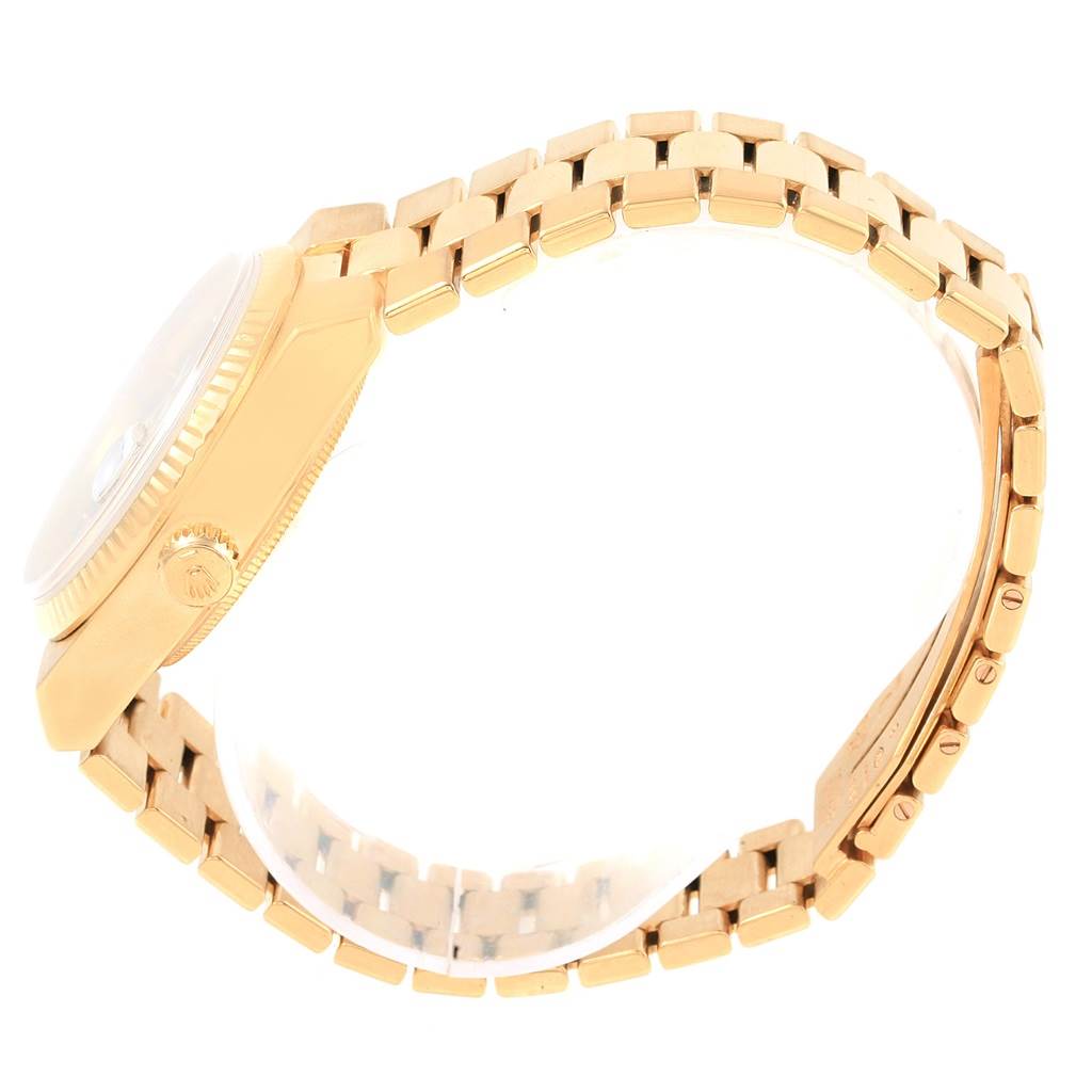 The image shows a side view of a Rolex Oysterquartz 19018 Men
s Yellow Gold Black Dial 19018 Men
s Yellow Gold Black Dial watch, highlighting its gold case and bracelet.