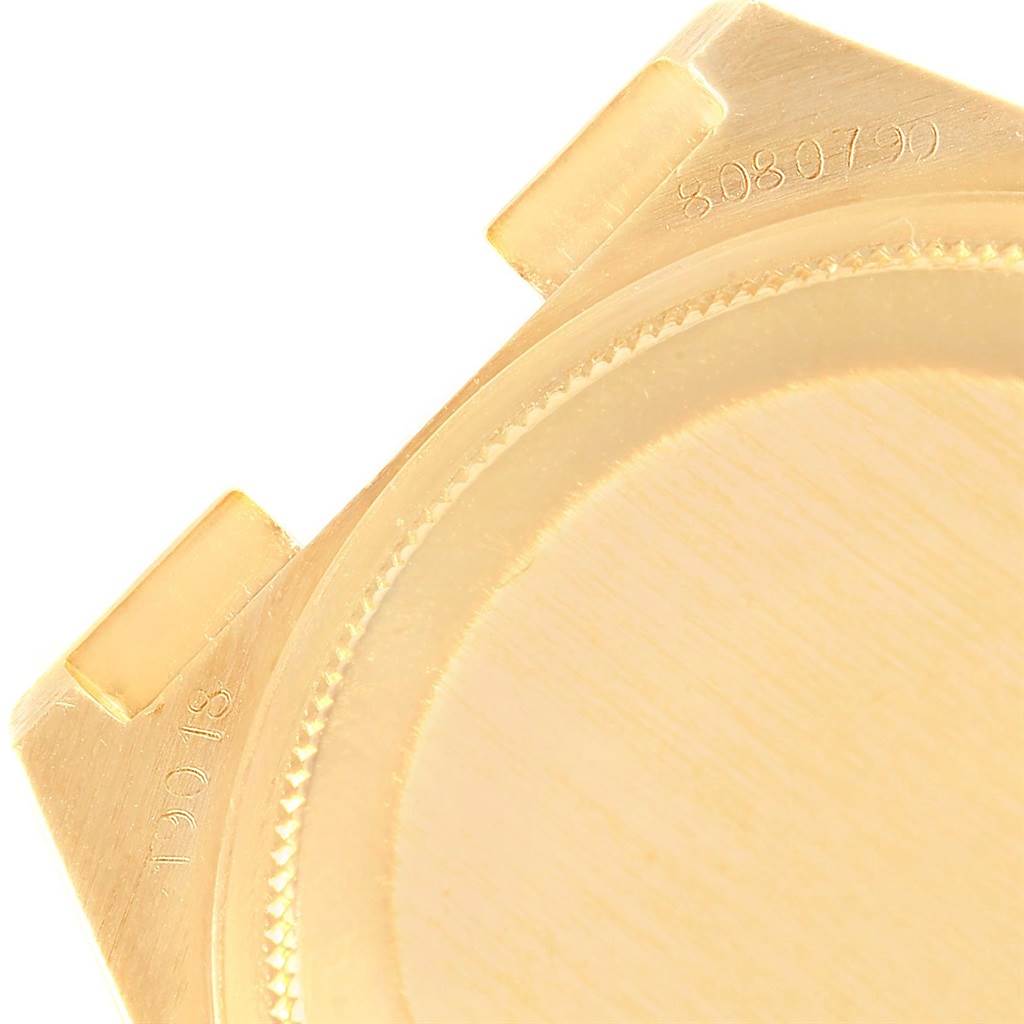 The image shows a partial view of the case back and lugs of a Rolex Oysterquartz 19018 Men
s Yellow Gold Black Dial 19018 Men
s Yellow Gold Black Dial watch.