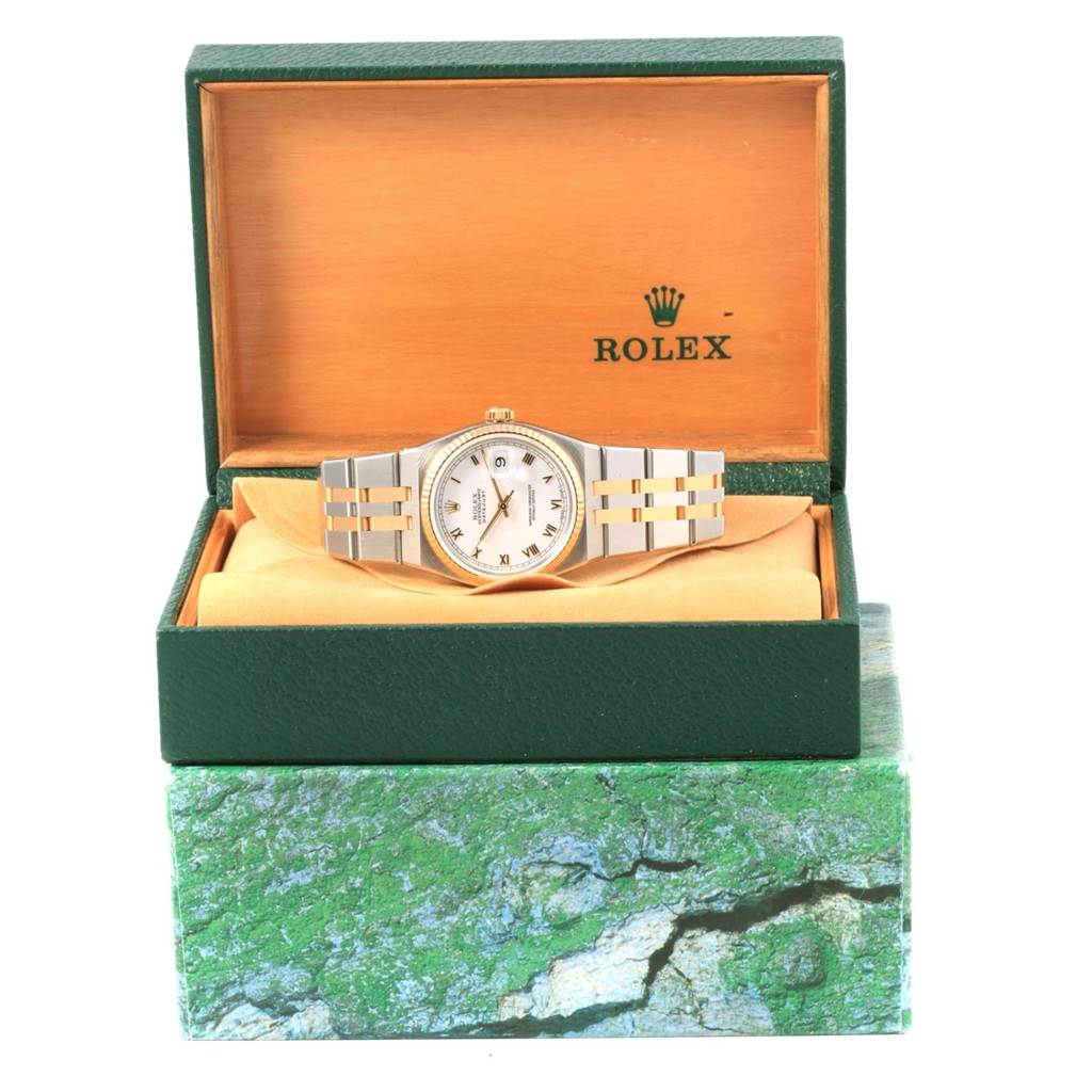 The Rolex Oysterquartz 17013 Men's Stainless Steel White Dial 17013 Men's Stainless Steel White Dial watch is shown at a front angle, resting in an open Rolex box with its bracelet fully visible.