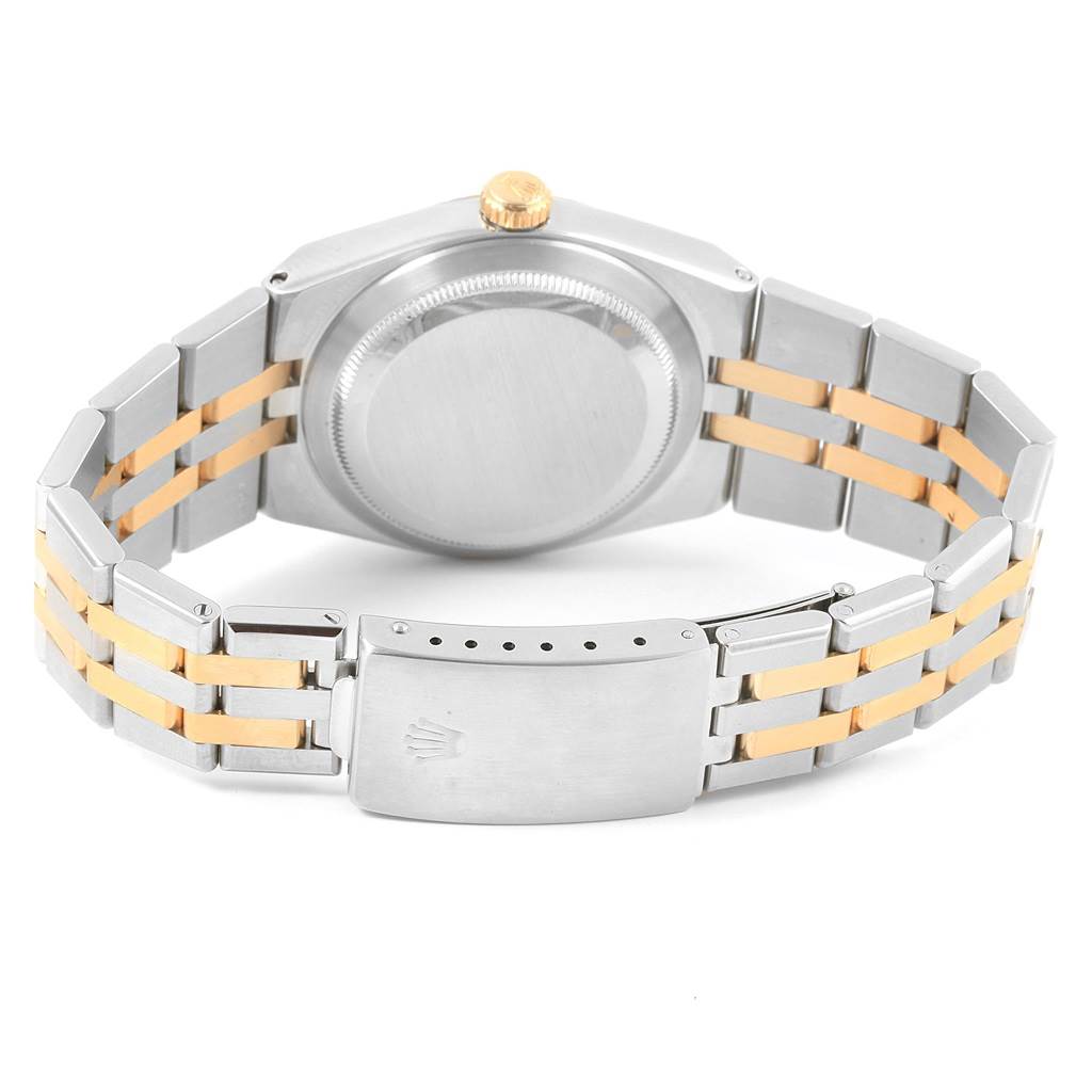 This image shows the back case and two-tone metal bracelet of the Rolex Oysterquartz 17013 Men's Stainless Steel White Dial 17013 Men's Stainless Steel White Dial watch.