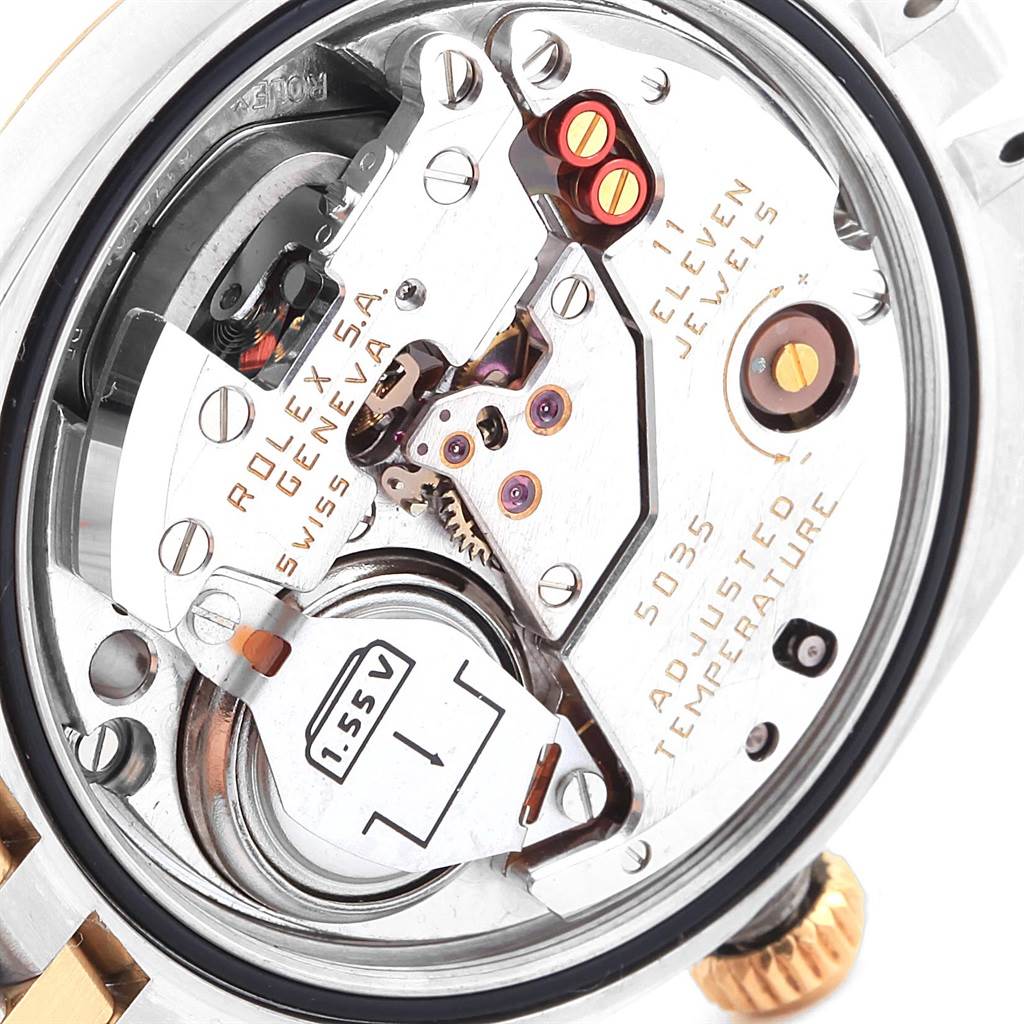 This image shows a close-up view of the movement mechanisms inside a Rolex Oysterquartz 17013 Men's Stainless Steel White Dial 17013 Men's Stainless Steel White Dial watch.