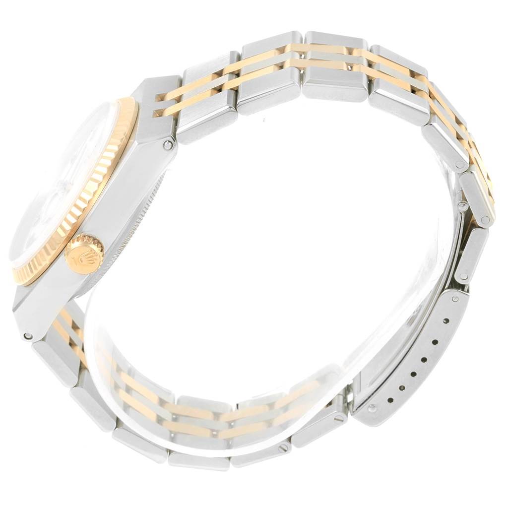 This Rolex Oysterquartz 17013 Men's Stainless Steel White Dial 17013 Men's Stainless Steel White Dial watch is shown from a side angle, highlighting its two-tone bracelet, bezel, and crown.