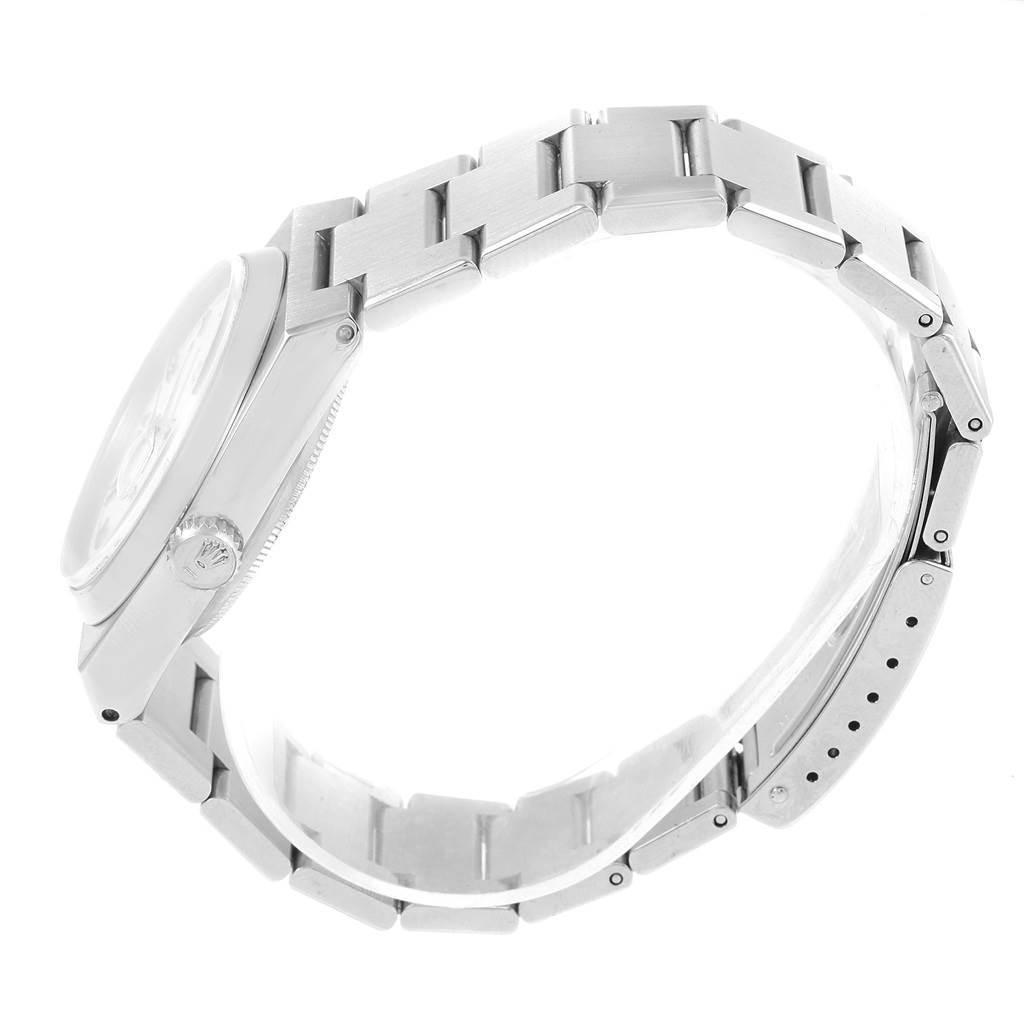 The image shows a side view of the Rolex Oysterquartz 17000 Men's Stainless Steel White Dial 17000 Men's Stainless Steel White Dial model, highlighting its case, crown, and metal bracelet.