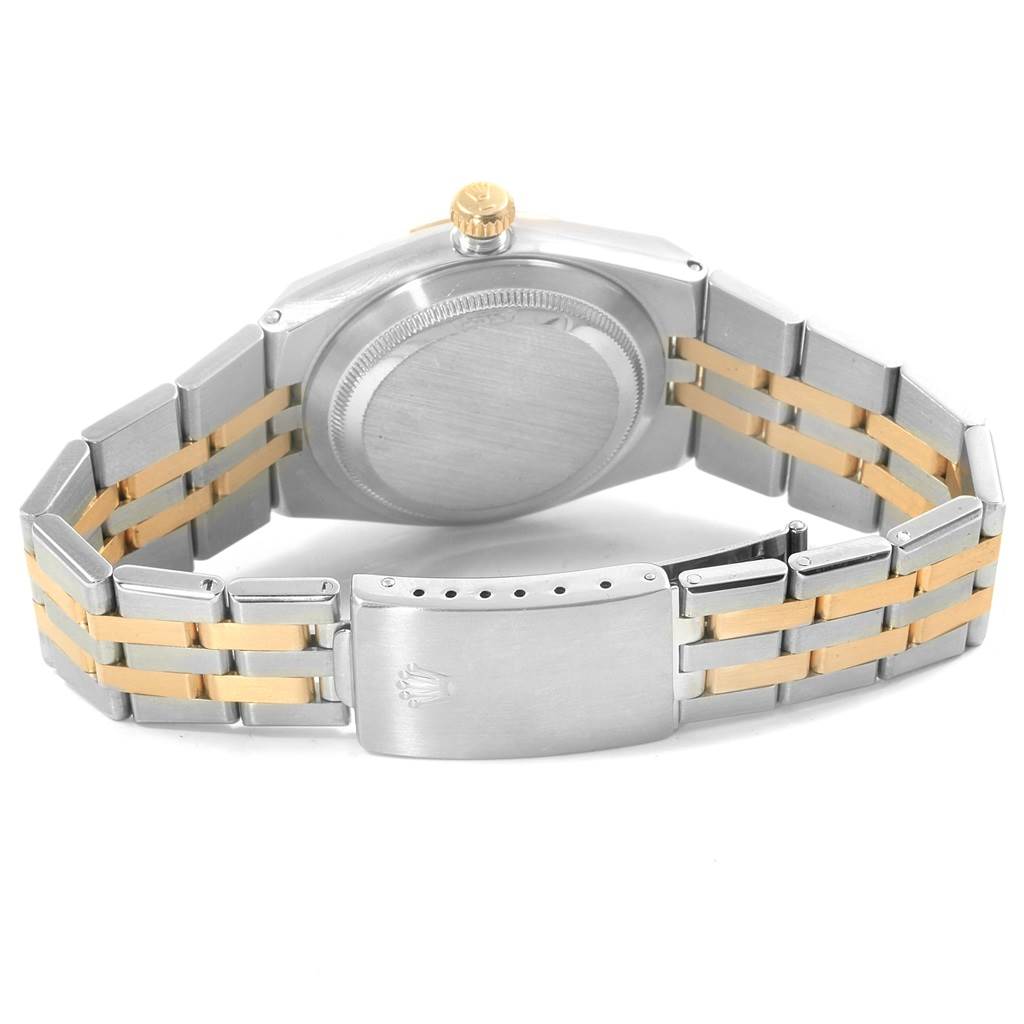 The image shows the back view of a Rolex Oysterquartz 17013 Men
s Stainless Steel Blue Dial 17013 Men
s Stainless Steel Blue Dial watch, displaying the case back, crown, and two-tone metal bracelet with clasp.