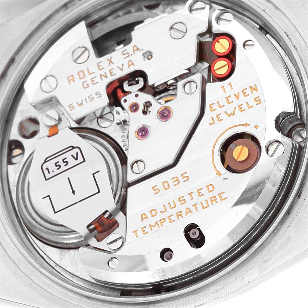 Close-up view of the internal mechanism of a Rolex Oysterquartz 17013 Men
s Stainless Steel Blue Dial 17013 Men
s Stainless Steel Blue Dial watch, displaying components and inscriptions.