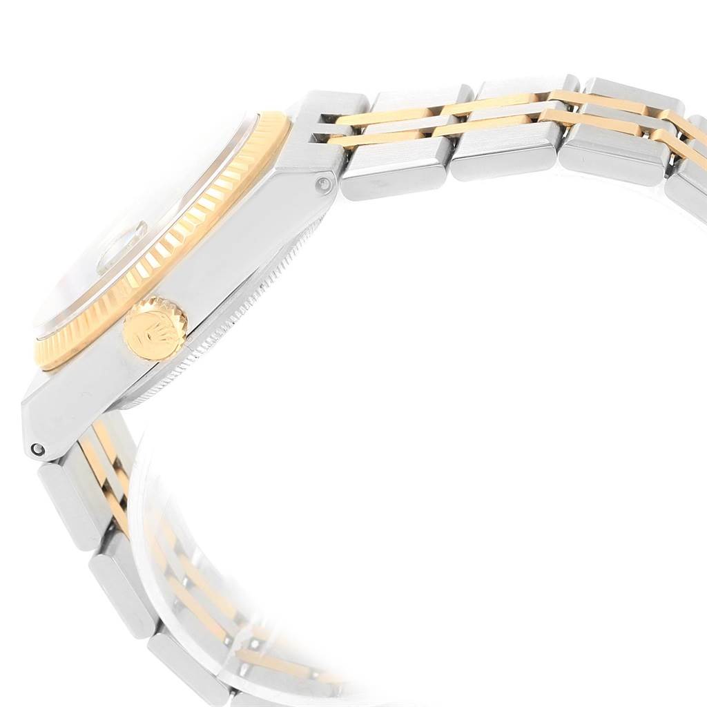 This image shows a side view of the Rolex Oysterquartz 17013 Men
s Stainless Steel Blue Dial 17013 Men
s Stainless Steel Blue Dial watch focusing on its case, crown, and metal bracelet.