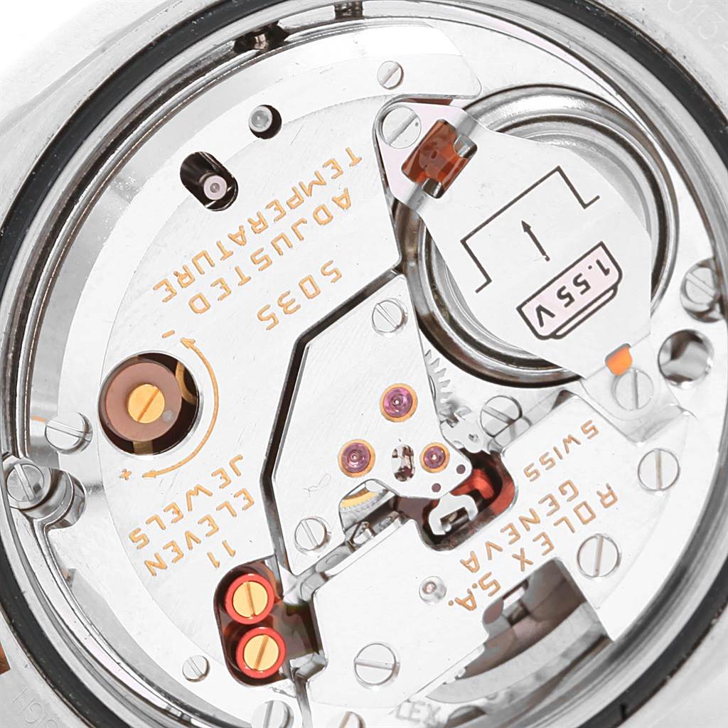The image shows a close-up view of the movement and inner mechanics of a Rolex Oysterquartz 17013 Men's Stainless Steel Blue Dial 17013 Men's Stainless Steel Blue Dial watch.