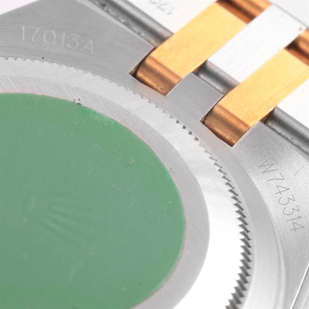 The image shows a close-up of the back cover and bracelet of a Rolex Oysterquartz 17013 Men's Stainless Steel Blue Dial 17013 Men's Stainless Steel Blue Dial model.