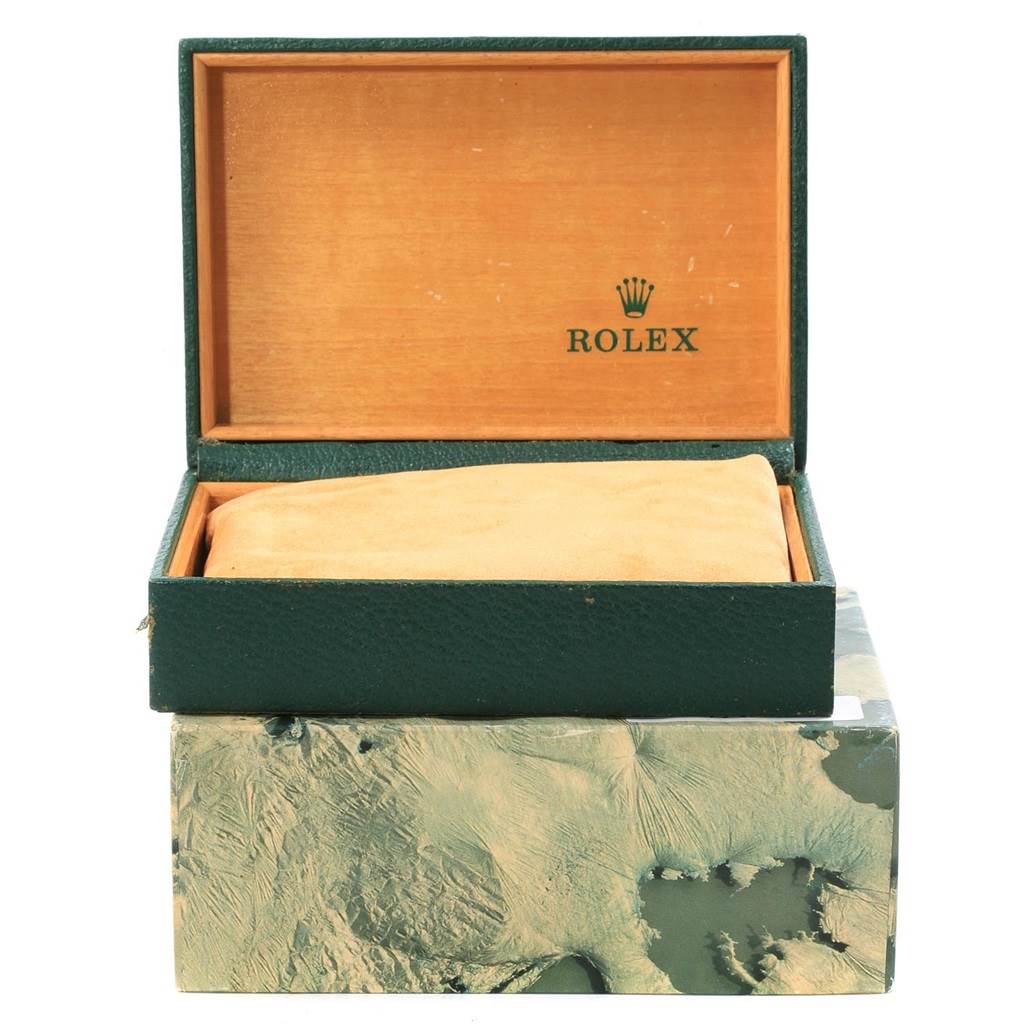 Rolex Oysterquartz 17000 Men's Stainless Steel Black Dial 17000 Men's Stainless Steel Black Dial watch box with green exterior, wooden interior, and beige cushion, shown from the front with the lid open.