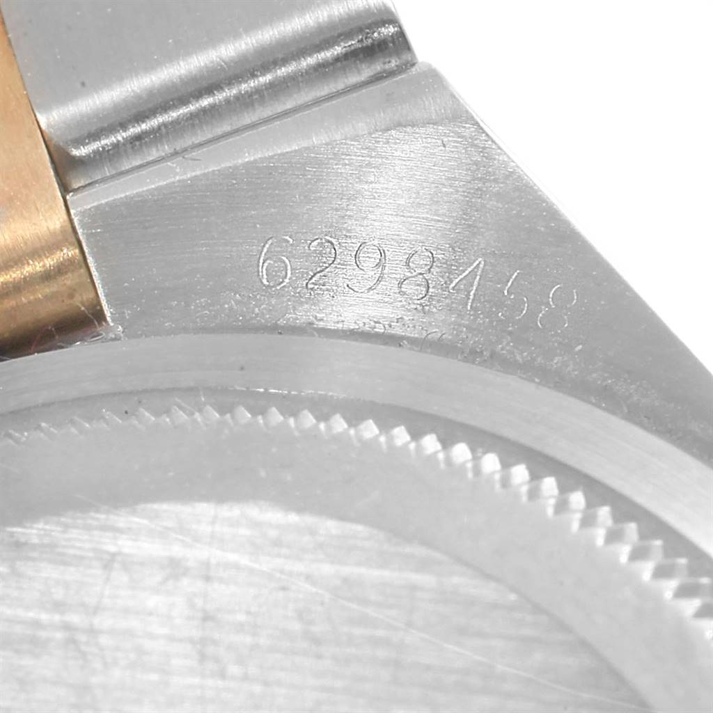 The image shows a close-up of the serial number and case edge of a Rolex Oysterquartz 17013 Men
s Stainless Steel Champagne Dial 17013 Men
s Stainless Steel Champagne Dial watch.