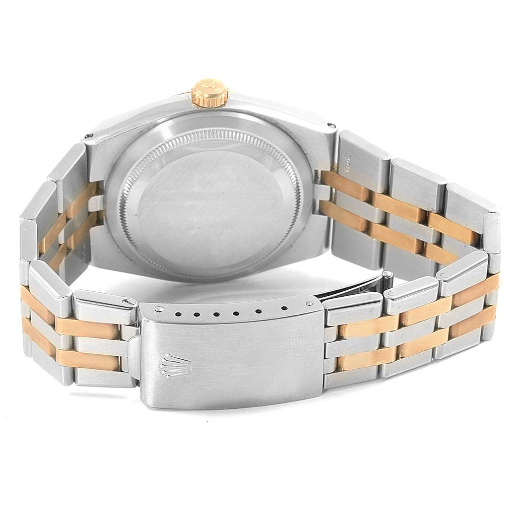 The image shows the back case, crown, and bracelet of a Rolex Oysterquartz 17013 Men
s Stainless Steel Champagne Dial 17013 Men
s Stainless Steel Champagne Dial watch at a rear angle.