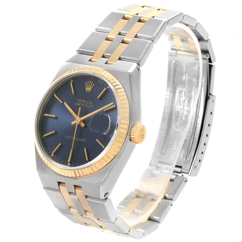 The image shows a Rolex Oysterquartz 17013 Men's Stainless Steel Blue Dial 17013 Men's Stainless Steel Blue Dial Datejust watch at a front-left angle, highlighting its blue dial, two-tone bracelet, and gold fluted bezel.
