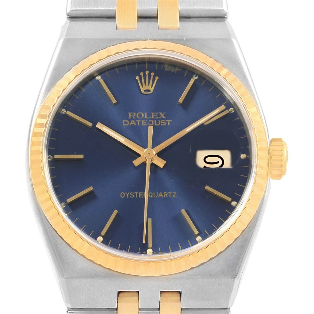 The image shows a front view of a Rolex Oysterquartz 17013 Men's Stainless Steel Blue Dial 17013 Men's Stainless Steel Blue Dial Datejust watch with a blue dial and gold accents.