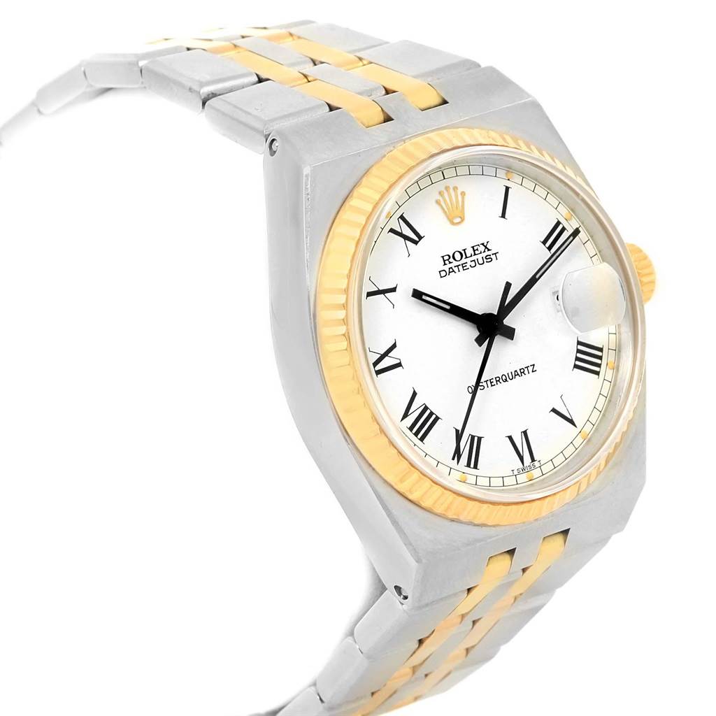 The Rolex Oysterquartz 17013 Men's Steel and Gold (two tone) White Dial 17013 Men's Steel and Gold (two tone) White Dial watch is shown at a tilted angle revealing the dial, bezel, crown, and part of the two-tone bracelet.