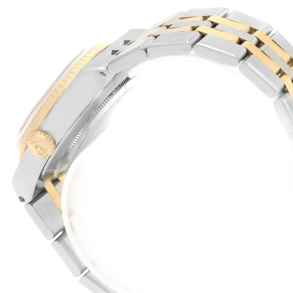 The image shows a side view of the Rolex Oysterquartz 17013 Men's Stainless Steel Champagne Dial 17013 Men's Stainless Steel Champagne Dial watch, highlighting the crown, case, and two-tone bracelet.