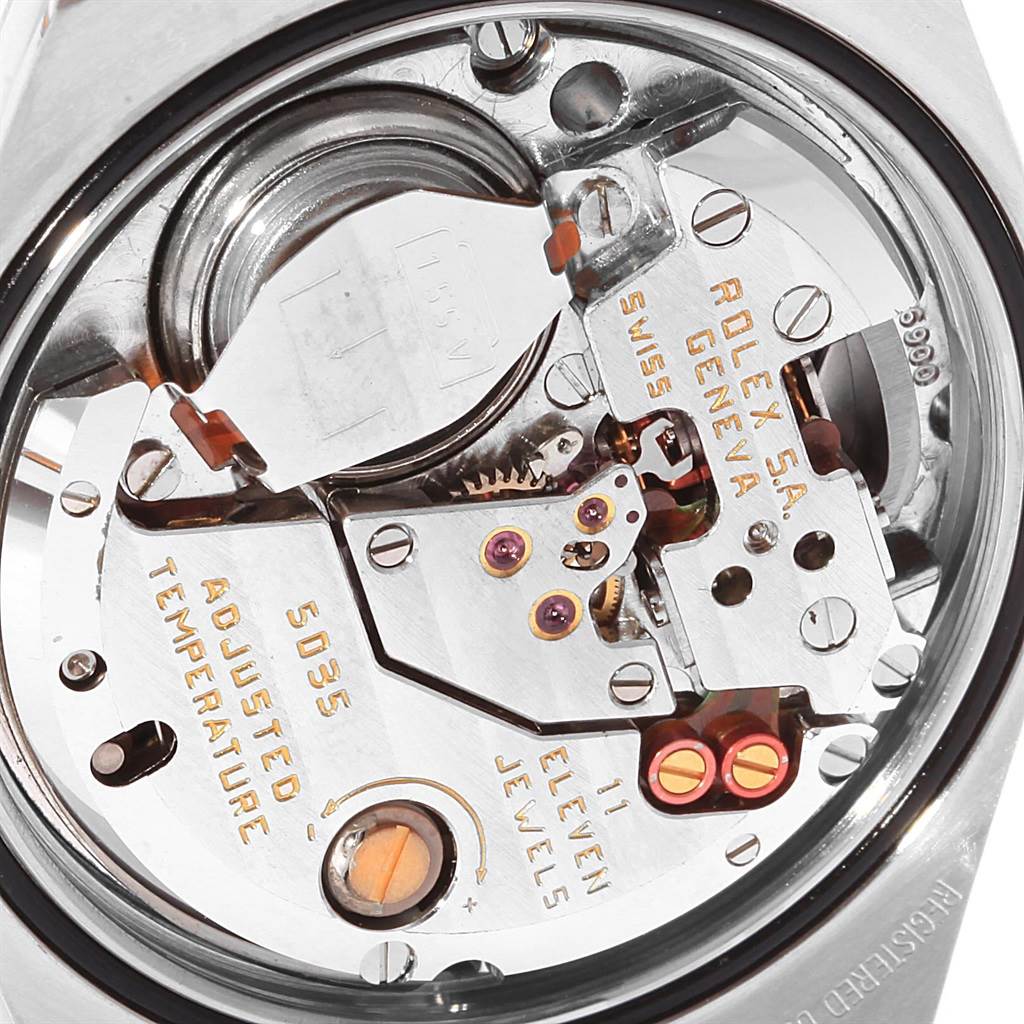 This close-up image shows the movement and internal components of a Rolex Oysterquartz 17013 Men's Stainless Steel Champagne Dial 17013 Men's Stainless Steel Champagne Dial watch from the back.