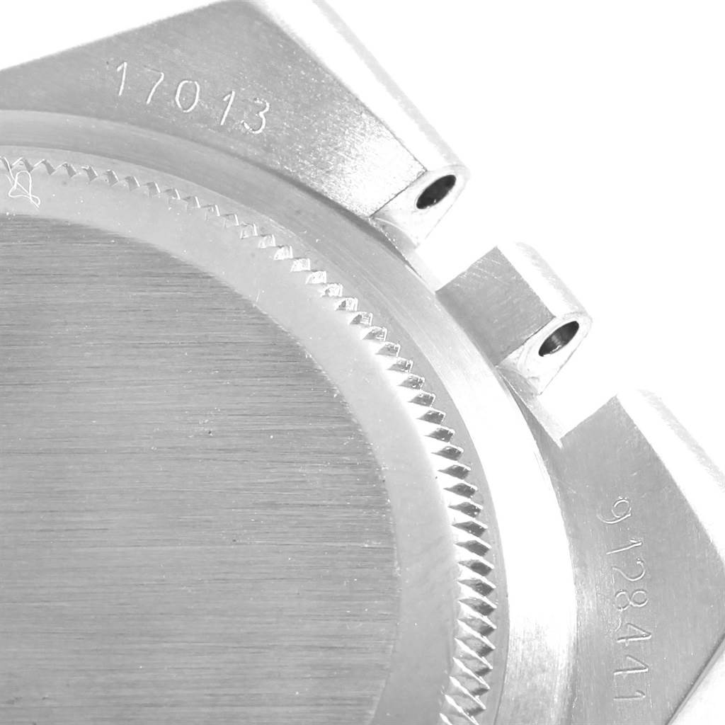 The image shows a close-up of the Rolex Oysterquartz 17013 Men's Steel and Gold (two tone) White Dial 17013 Men's Steel and Gold (two tone) White Dial watch case back and lugs, with visible model and serial numbers.