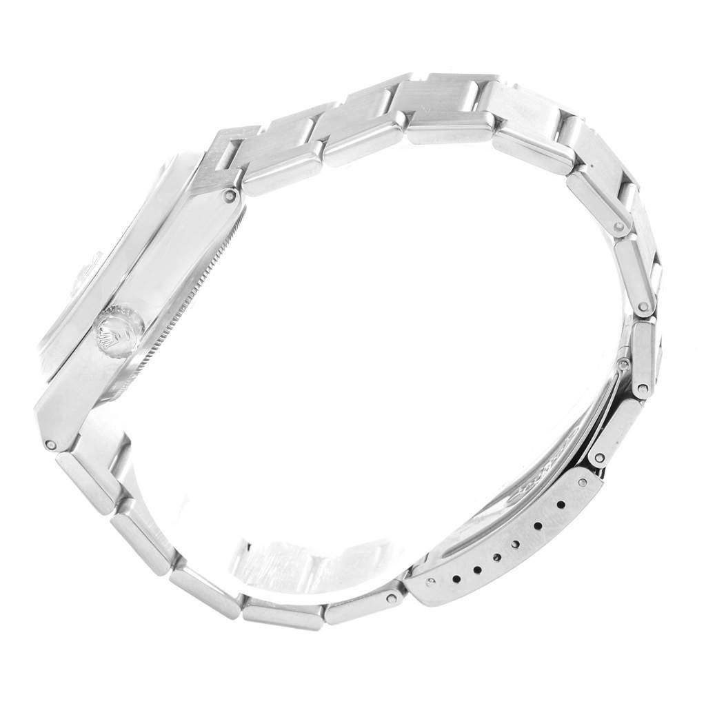 This image shows a side view of a Rolex Oysterquartz 17000 Men
s Stainless Steel Silver Dial 17000 Men
s Stainless Steel Silver Dial watch, focusing on the case, crown, and metal bracelet.