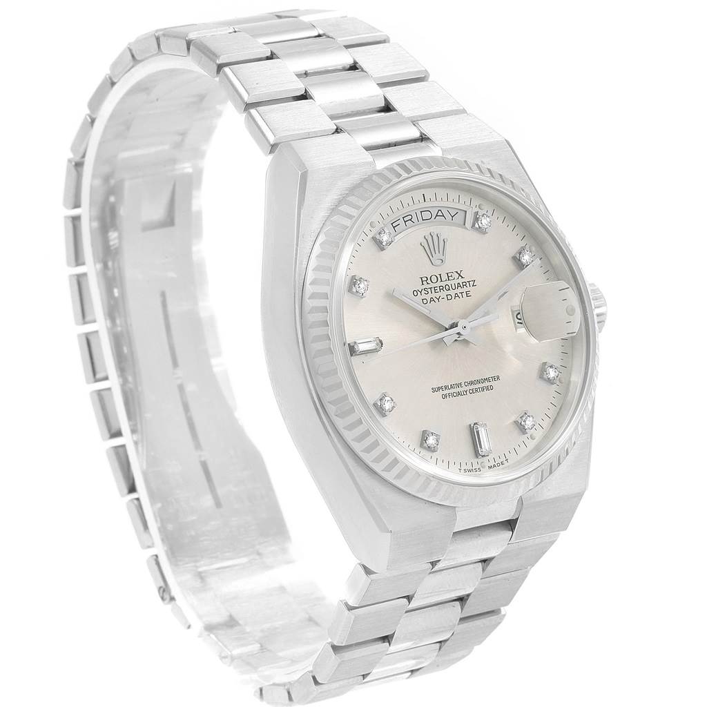 The Rolex Oysterquartz 19019 Men's White Gold Silver Dial 19019 Men's White Gold Silver Dial watch is shown at a three-quarter angle, displaying its bracelet, bezel, and dial with day and date features.