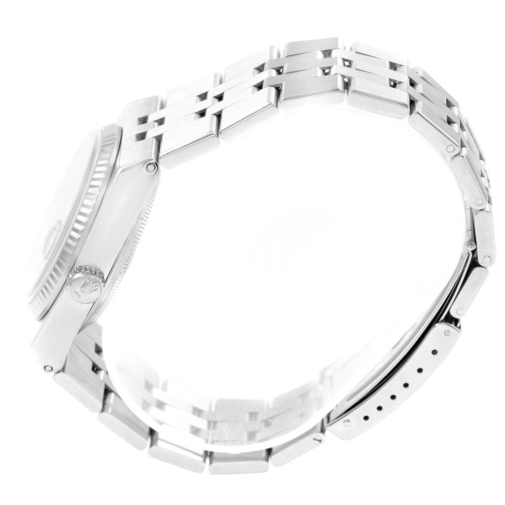 The image shows a side view of the Rolex Oysterquartz 17014 Men's Stainless Steel Blue Dial 17014 Men's Stainless Steel Blue Dial watch, highlighting the band, clasp, and crown.