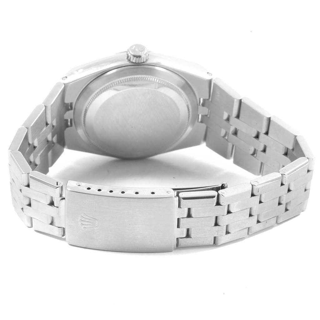 The image shows the underside of a Rolex Oysterquartz 17014 Men's Stainless Steel Blue Dial 17014 Men's Stainless Steel Blue Dial watch, focusing on the case back, crown, and bracelet clasp.