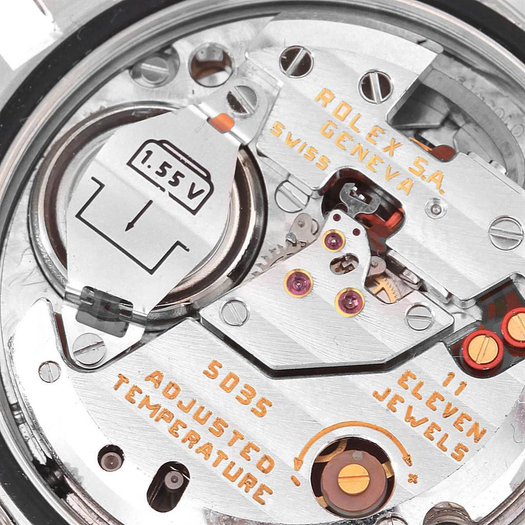This close-up image shows the inner mechanics and battery compartment of a Rolex Oysterquartz 17014 Men's Stainless Steel Blue Dial 17014 Men's Stainless Steel Blue Dial watch model 5035.