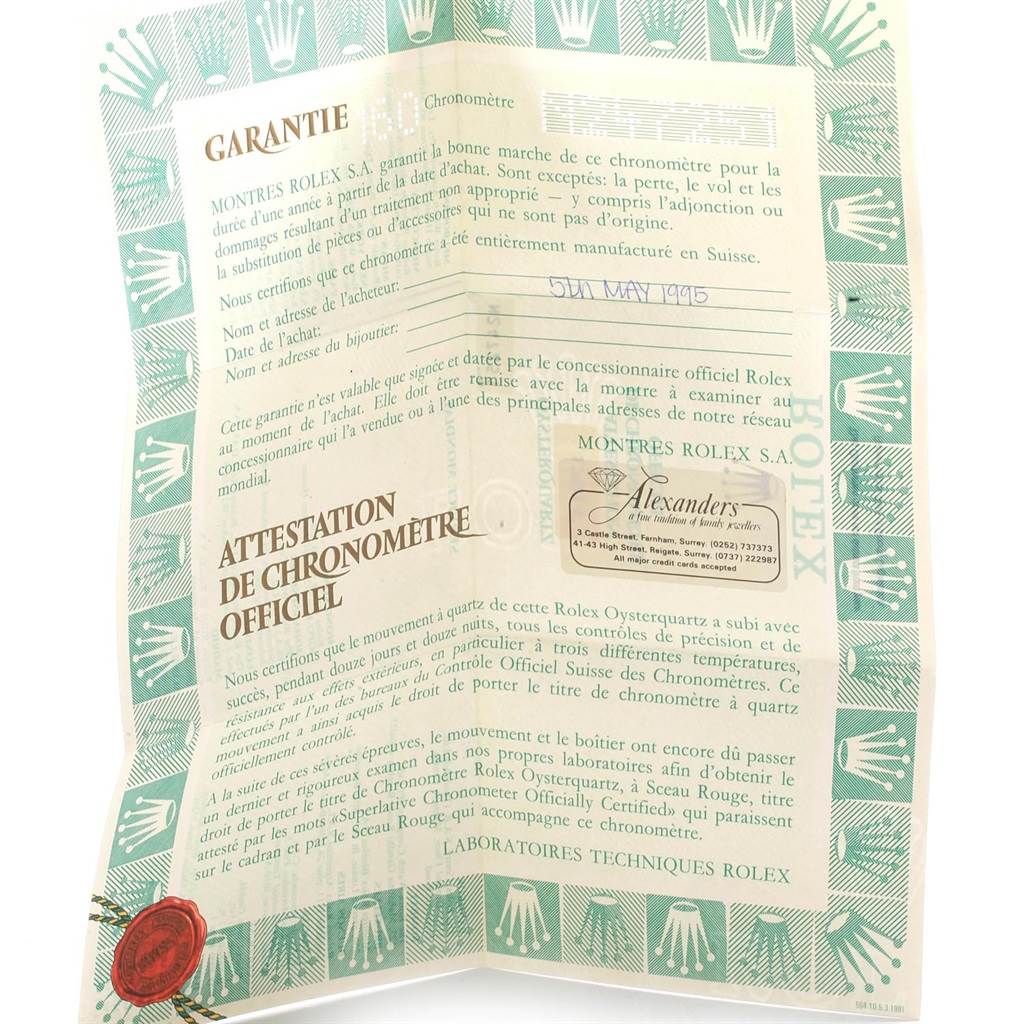 The image shows a certificate of authenticity and warranty for a Rolex Oysterquartz 17014 Men's Stainless Steel Blue Dial 17014 Men's Stainless Steel Blue Dial watch.