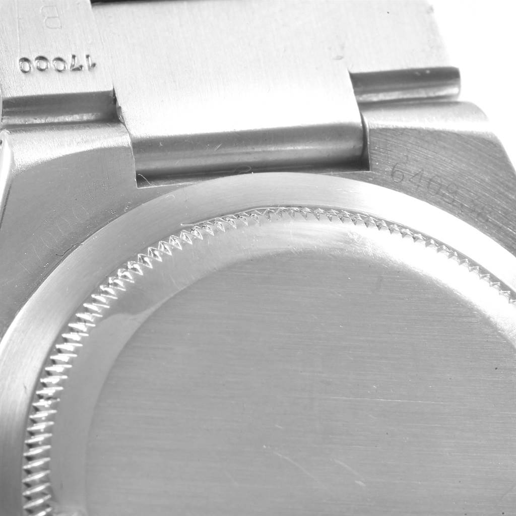 The image shows a close-up of the back case and part of the bracelet of a Rolex Oysterquartz 17000 Men's Stainless Steel White Dial 17000 Men's Stainless Steel White Dial watch.