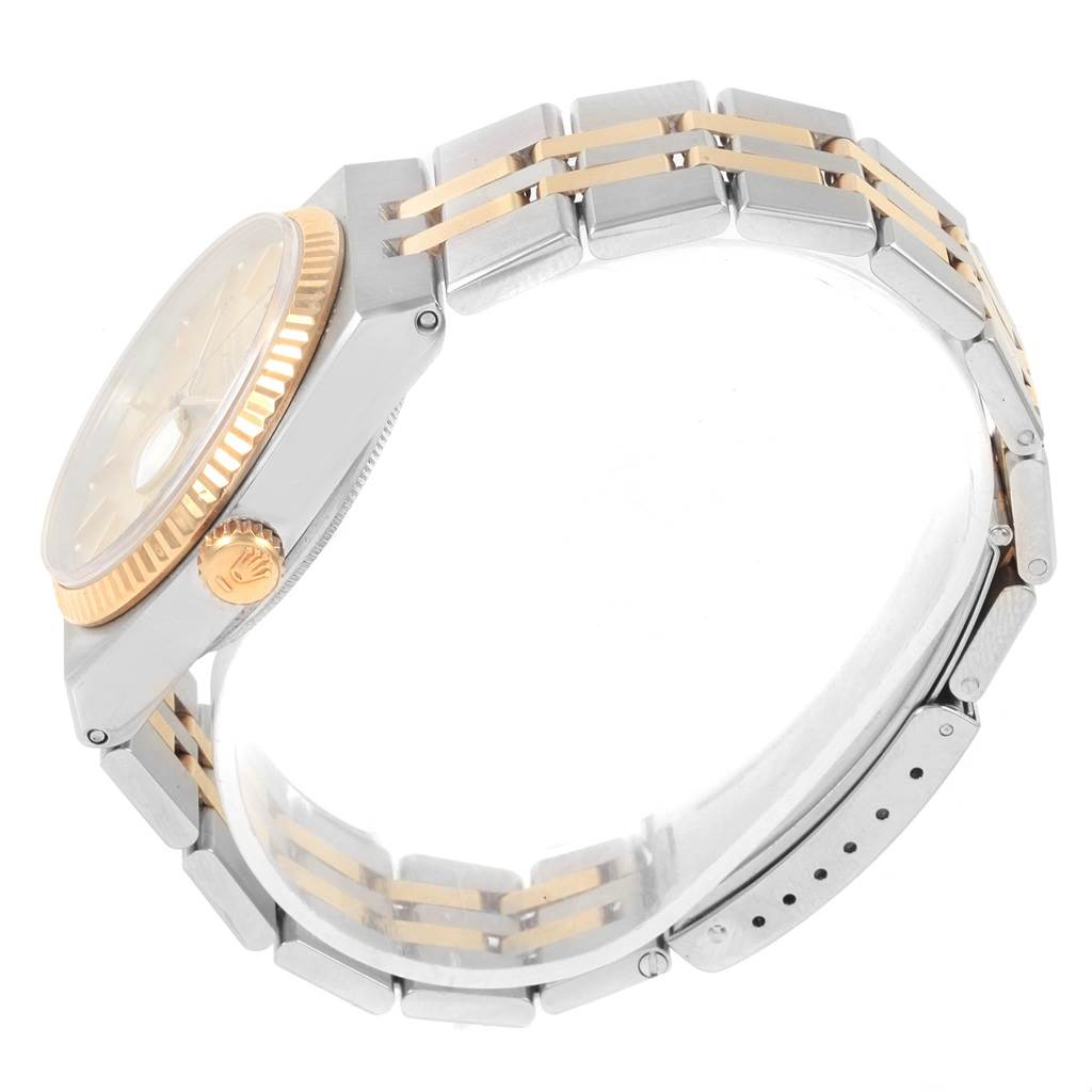 The image shows the side profile of the Rolex Oysterquartz 17013 Men
s Stainless Steel Champagne Dial 17013 Men
s Stainless Steel Champagne Dial watch, focusing on the case, crown, and bracelet.