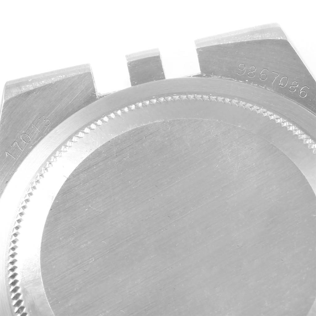 This image shows the back case of a Rolex Oysterquartz 17013 Men
s Stainless Steel Champagne Dial 17013 Men
s Stainless Steel Champagne Dial watch, including parts of the case edges and serial number.