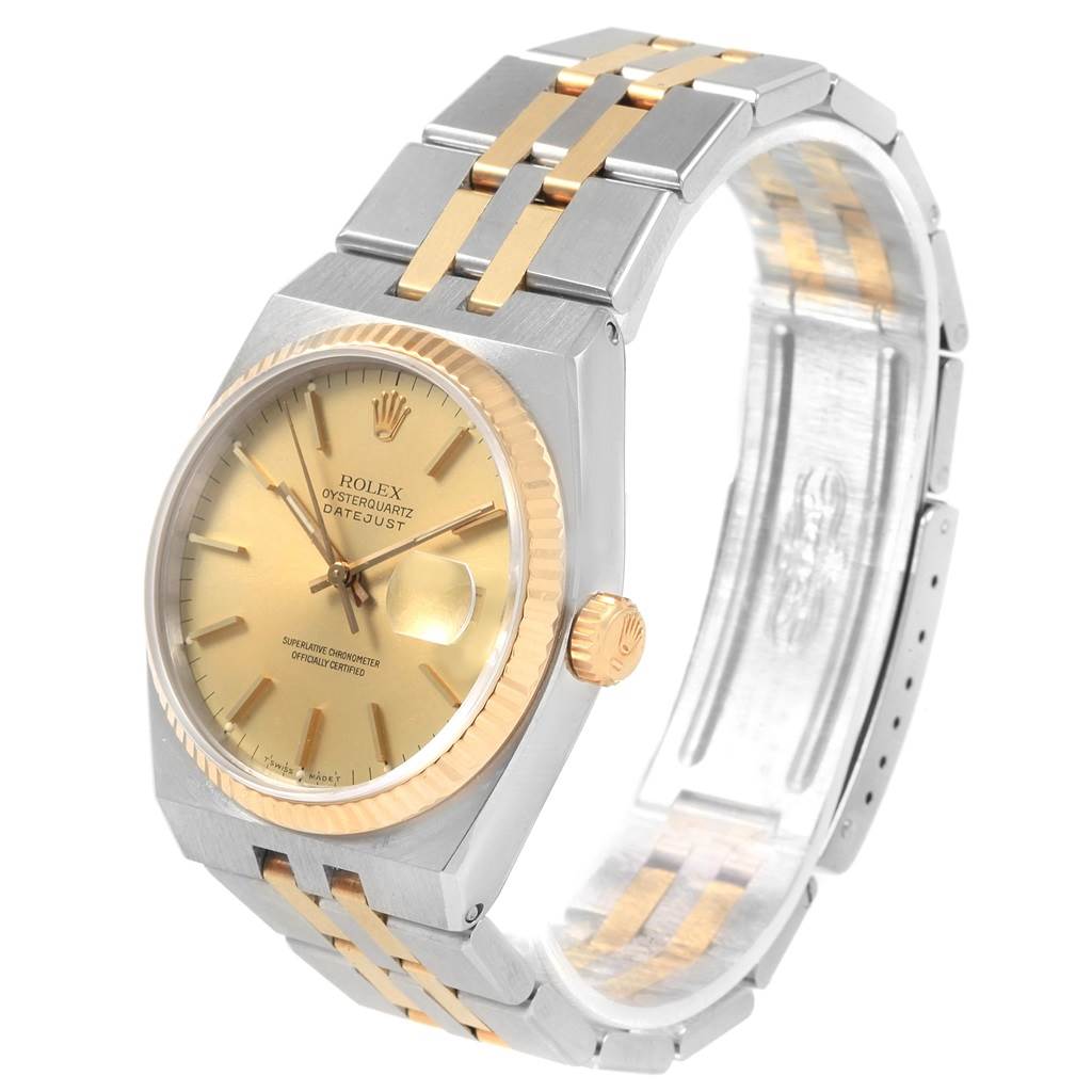 This Rolex Oysterquartz 17013 Men
s Stainless Steel Champagne Dial 17013 Men
s Stainless Steel Champagne Dial model watch is shown at a three-quarter angle, highlighting the gold-tone dial, bezel, and two-tone bracelet.