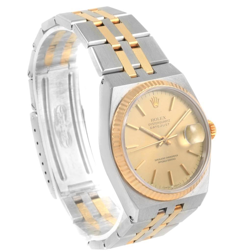 The Rolex Oysterquartz 17013 Men
s Stainless Steel Champagne Dial 17013 Men
s Stainless Steel Champagne Dial watch is shown at an angle, highlighting the face, crown, bezel, and the two-tone bracelet.