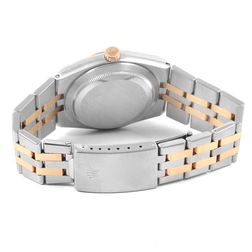 The image shows the back case, crown, and clasp of a Rolex Oysterquartz 17013 Men
s Stainless Steel Champagne Dial 17013 Men
s Stainless Steel Champagne Dial watch, along with its two-tone metal bracelet.